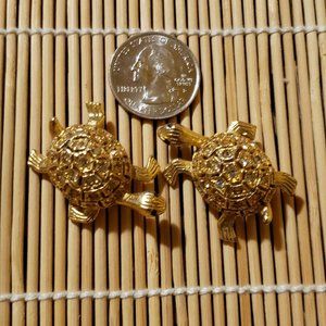 A Set Of Two Turtle Brooches.